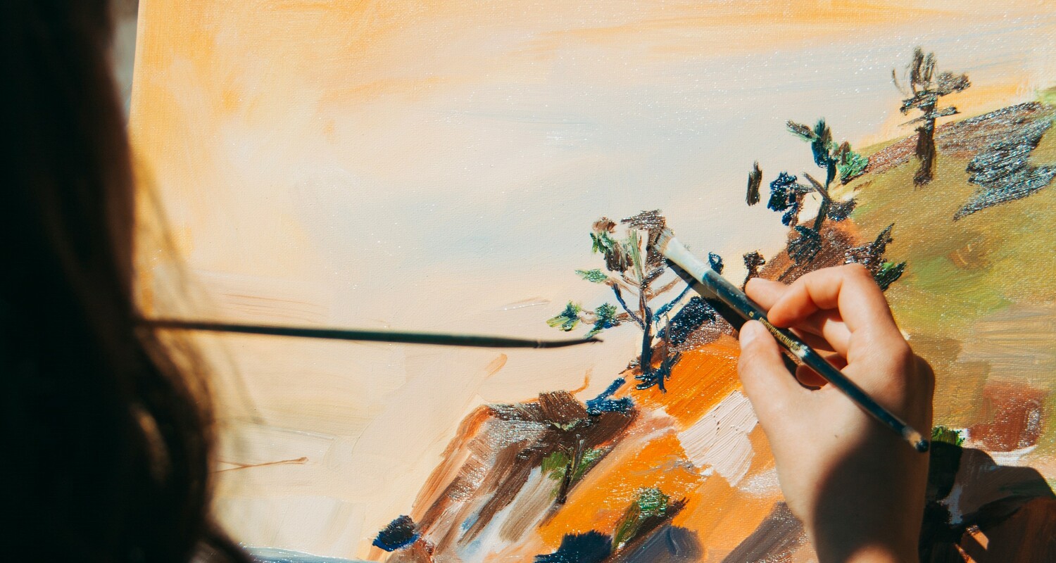 a person painting a landscape